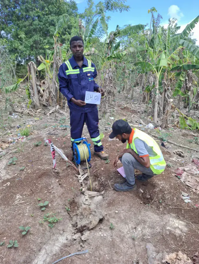 Binsalim field team recording site investigation measurements in Zanzibar